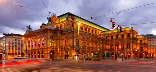 Scenic view of Vienna cityscape overlooking central avenue and neo-Renaissance building of State Opera with evening illumination in winter, Austria.