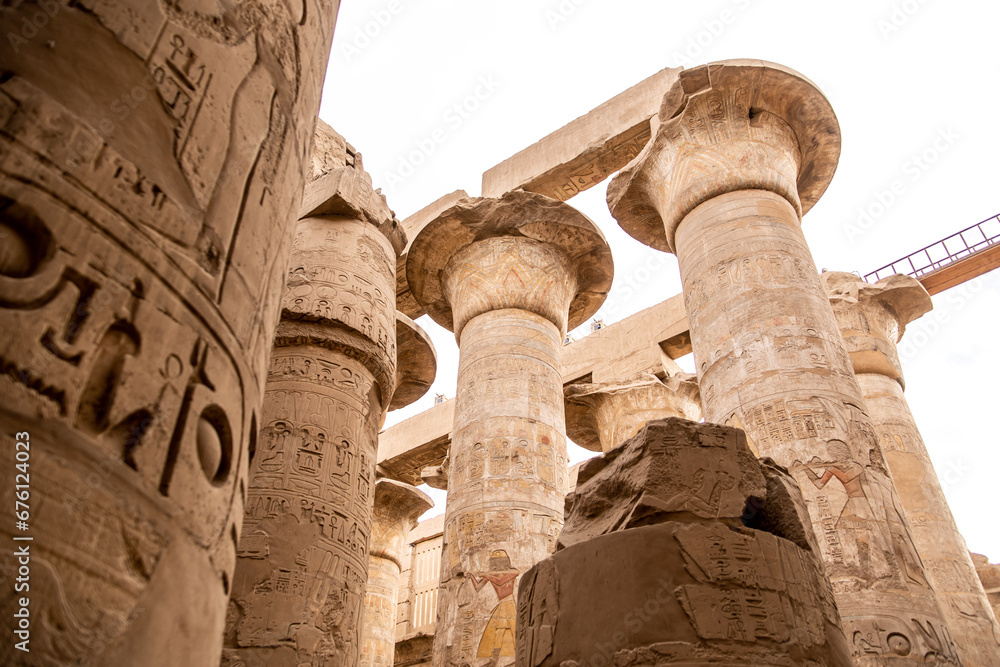 ancient Egyptian hieroglyphs on massive columns of hippostyle hall in karnak temple in luxor, egypt ancient Egyptian hieroglyphs on massive columns of hippostyle hall in karnak temple in luxor, egypt