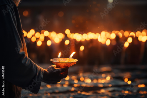 A person lighting a candle in memory of loved ones lost to cancer, highlighting the importance of remembrance on this day. Generative Ai. photo