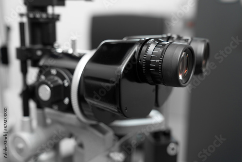 Canvas-taulu ophthalmic equipment placed in light contemporary optical shop for checking vision, slit lamp examination, ophthalmology concept, Slit lamp