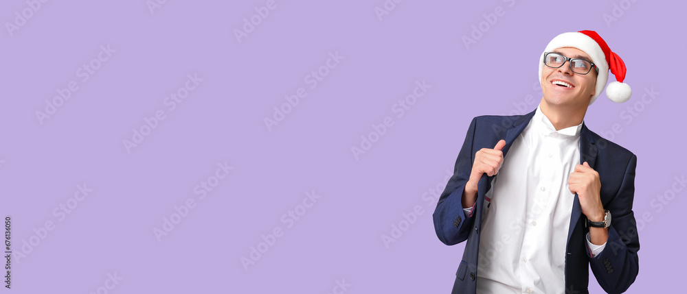 Businessman in Santa hat on lilac background with space for text Businessman in Santa hat on lilac background with space for text