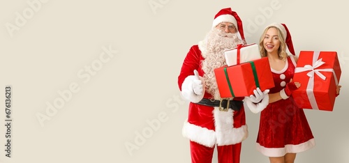 Happy Santa Claus and young...