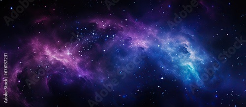The abstract image of a galaxy in the night sky with a background of black and blue is illuminated by the stars and a purple outer light