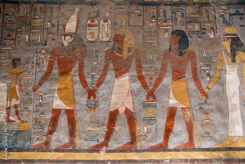 colorful hieroglyphs in ancient egyptian tomb in the valley of the kings in luxor, egypt photo