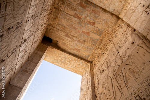 colorful hieroglyphs on an archway in anicent egyptian temple photo