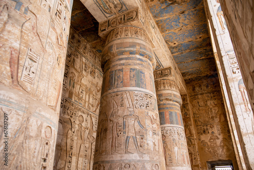 large colorful hieroglyphs on columns in ancient egyptian temple in luxor, egypt