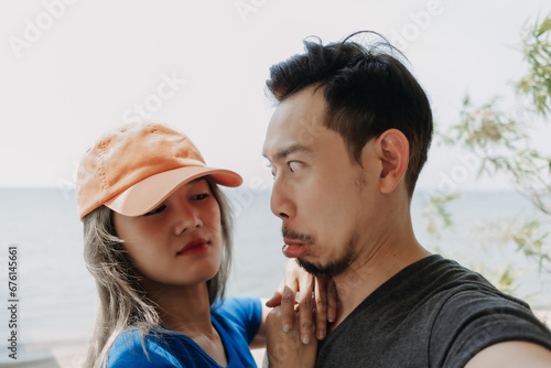 Funny and cheerful selfie portrait of asian couple lover.