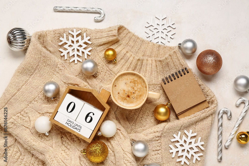 Christmas composition with cup of coffee and cube calendar on beige background Christmas composition with cup of coffee and cube calendar on beige background