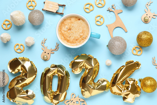 Beautiful composition with cup of coffee and Christmas decor on blue background
