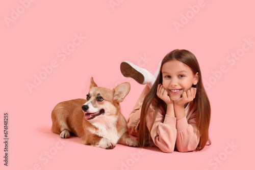 Little girl with cute Corgi...