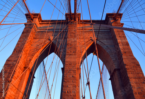  Brooklyn Bridge is one of the oldest suspension bridges in the US. Completed in 1883, it connects the New York City boroughs of Manhattan and Brooklyn by spanning the East  photo