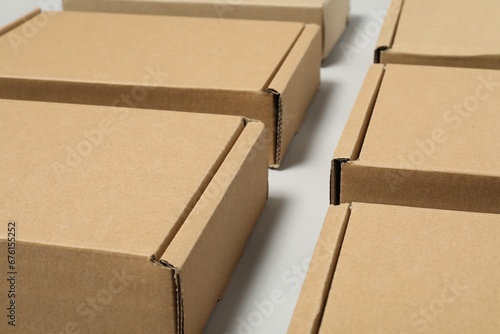 Many cardboard boxes on white background. Packaging goods © New Africa