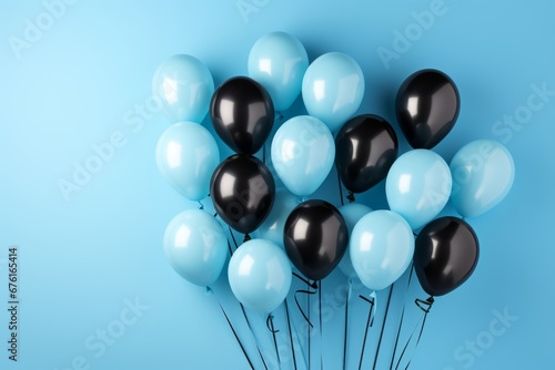 Set of vibrant blue, black, and white balloons floating gracefully against a clean white backdrop