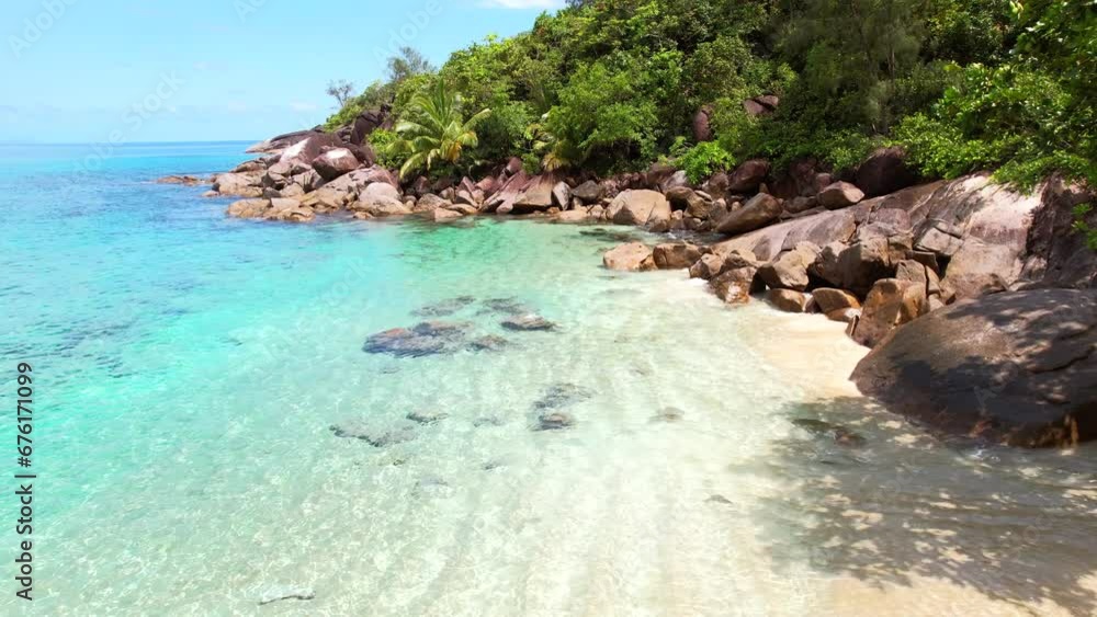 Drone shot near white sandy beach, turquoise water and lush vegetation near the shore, anse major beach, Mahe, Seychelles 30fps Drone shot near white sandy beach, turquoise water and lush vegetation near the shore, anse major beach, Mahe, Seychelles 30fps