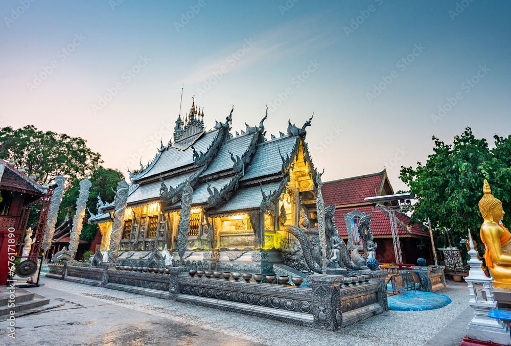 Naklejka premium Wat Sri Suphan,metallic Silver Buddhist temple,illuminated at dusk,Chaingmai old town,Thailand.