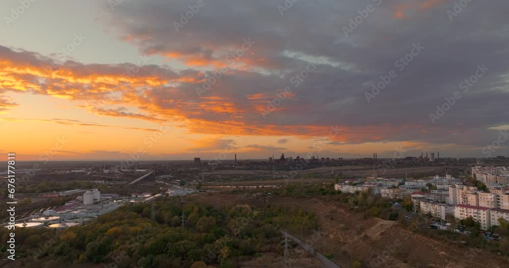 Aerial wide shot over big forest revealing a city skyline blending seamlessly with the natural landscape in sunset warm light, HDR 4K50Fps Aerial wide shot over big forest revealing a city skyline blending seamlessly with the natural landscape in sunset warm light, HDR 4K50Fps