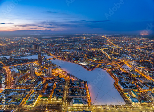 Embankment of the central pond and Plotinka in Yekaterinburg at winter sunset. The historic center of the city of Yekaterinburg, Russia, Aerial View © Dmitrii Potashkin