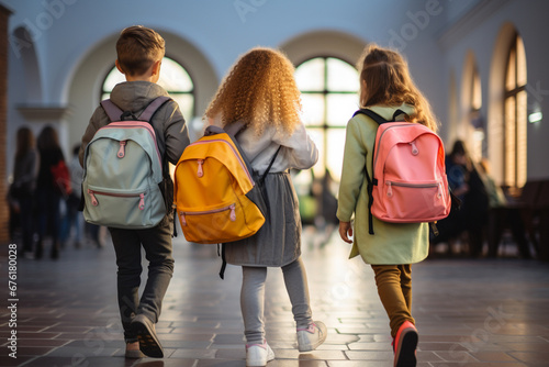 The back view of a little kid wearing bright and colorful backpacks while walking into the primary or elementary school with other stridents. Generative AI. photo