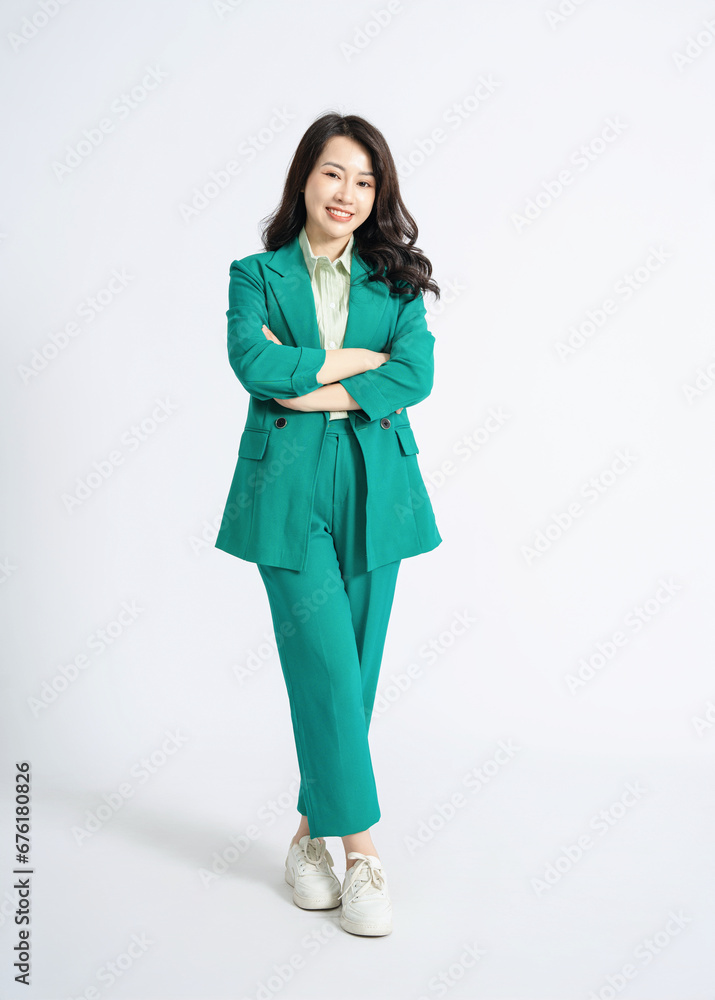 Image of young Asian business woman on background