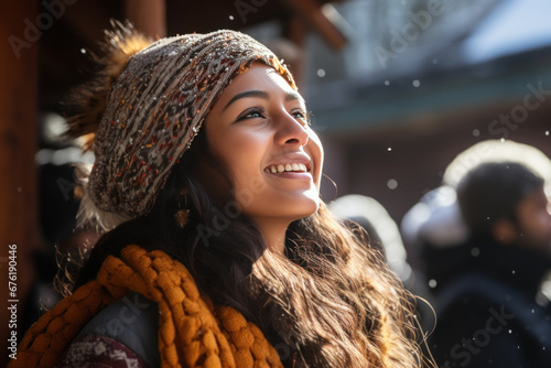 A Indian woman breathes calmly looking up enjoying winter season