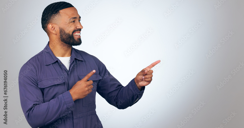 Happy man, pointing and mockup space for advertising or marketing against a studio background. Male person or salesman smile showing deal, list or information for advertisement, notification or alert Happy man, pointing and mockup space for advertising or marketing against a studio background. Male person or salesman smile showing deal, list or information for advertisement, notification or alert