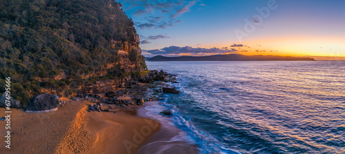Quadro su tela Aerial sunrise panorama over the headland, ocean, rocks and beach