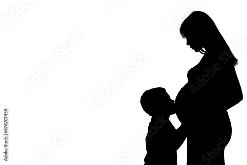 silhouette of a child kissing his pregnant mother's belly. Black and white. copy space. motherhood concept. Future mom. brother on the way concept.