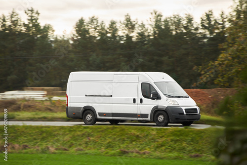 Wallpaper Mural On the Delivery Route. Commercial Van Close-Up on the Road. Logistics branding. Commercial van on the road. Final destination shipping truck mock-up. Torontodigital.ca