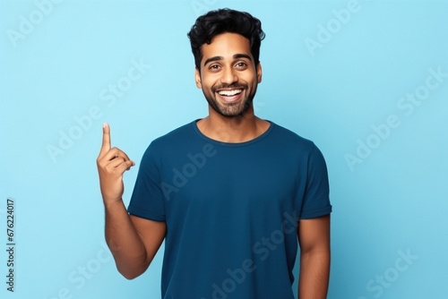 young indian man pointing
