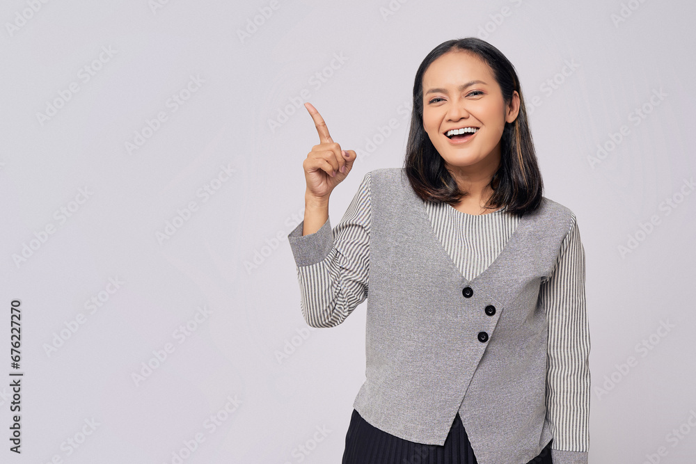 Smiling beautiful young Asian woman in casual clothes pointing fingers aside at copy space for your advertisement isolated on white background. People lifestyle concept Smiling beautiful young Asian woman in casual clothes pointing fingers aside at copy space for your advertisement isolated on white background. People lifestyle concept