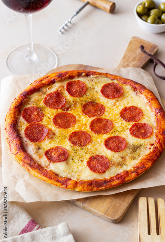 Pizza with pepperoni and cheese. Fast food. Italian cuisine. American food.