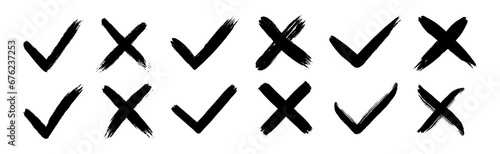 Dirty grunge hand drawn with brush strokes cross X and tick OK check marks V vector illustration set isolated on white background. Check mark symbol NO and YES buttons for vote in the box, web, etc photo