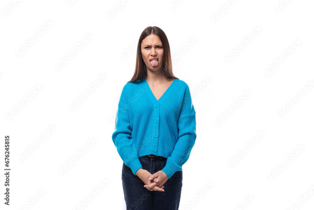 young surprised charming brunette lady dressed in blue blouse with v-neck on white background with copy space. people lifestyle concept young surprised charming brunette lady dressed in blue blouse with v-neck on white background with copy space. people lifestyle concept