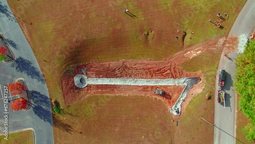 Aerial moving away shot of a drainage construction site in Dawsonville, Georgia. photo