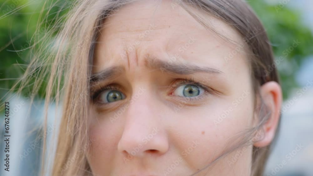 Woman showing disapproval or disbelief through her facial expression, static closeup Woman showing disapproval or disbelief through her facial expression, static closeup