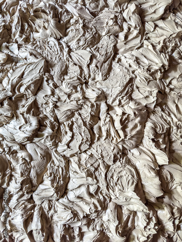 Top down full frame image of wet clay for ceramics 