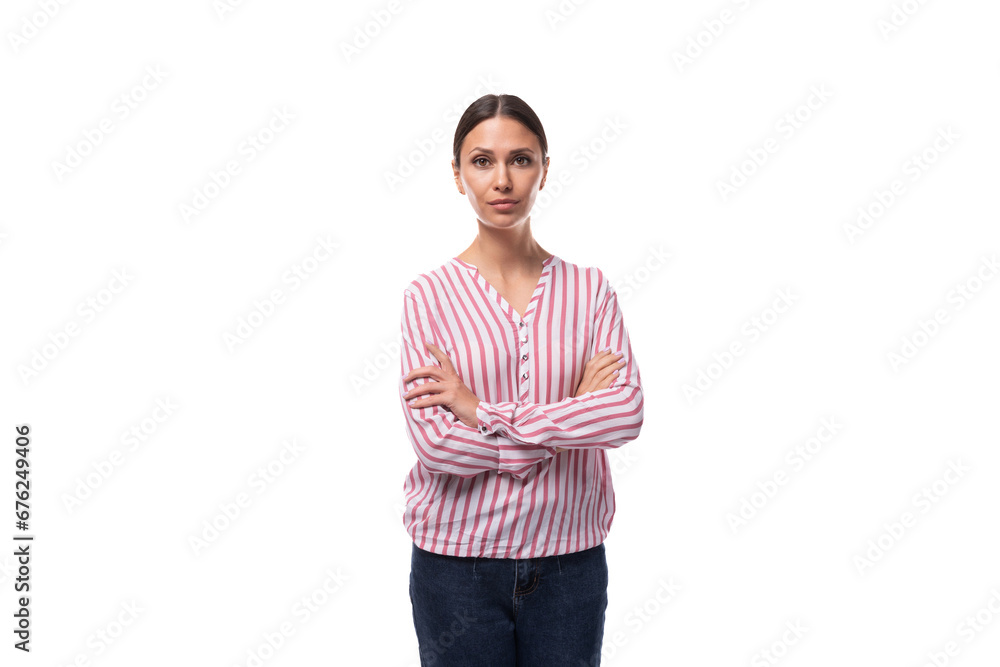 young slender well-groomed brunette leader woman with a ponytail hairstyle dressed in a striped blouse young slender well-groomed brunette leader woman with a ponytail hairstyle dressed in a striped blouse