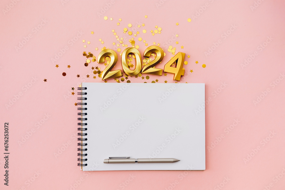 Happy New year and Christmas holiday concept 2024 with empty notebook and pen on pink background - obrazy, fototapety, plakaty 