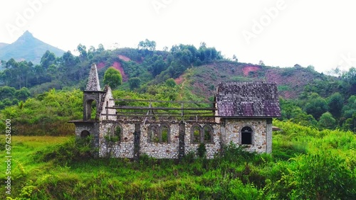 Wallpaper Mural Close up of old empty church in the green jungle. Tropical forest behind the destroyed church made of stones. Aerial shot. Torontodigital.ca