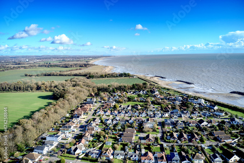 Aerial view of Elmer Village and the West Sussex coastline. photo