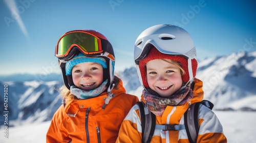 Portrait of a happy, smiling children snowboarder against the backdrop of snow-capped mountains at a ski resort, during the winter holidays. © ALA