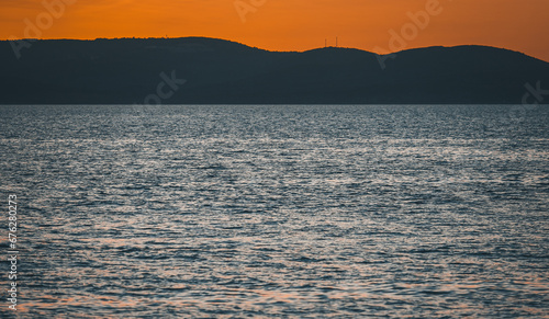 Colorful sunset on seaside. Beautiful dusk on summer resort in Croatia