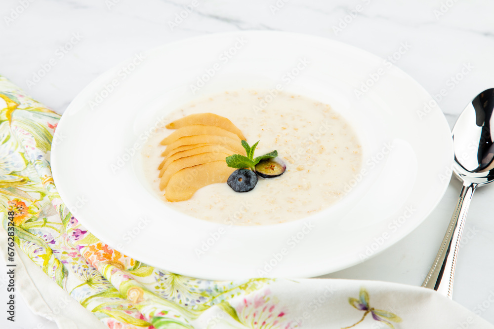healthy breakfast with fruits in a white plate side view healthy breakfast with fruits in a white plate side view