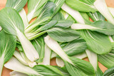Fresh bok choy leaves or chinese cabbage leaves close up. Food background.