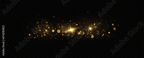 Golden sequins glow with many lights. Glittering dust. Luxurious background of golden particles.
