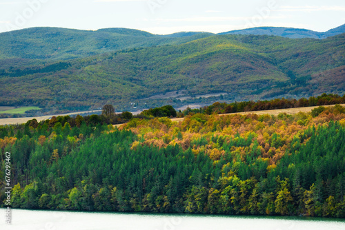 Fototapeta Naklejka Na Ścianę i Meble -  Sunny day in Autumn, trees with yellow orange, red leaves
