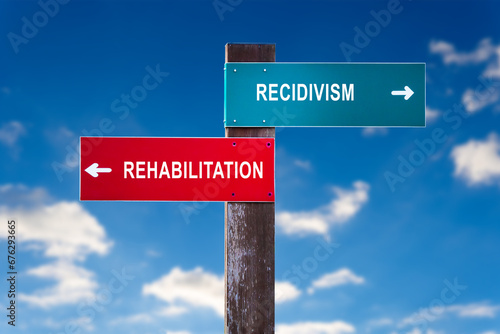 Obraz na plátne Recidivism versus Rehabilitation - Road sign with two options.