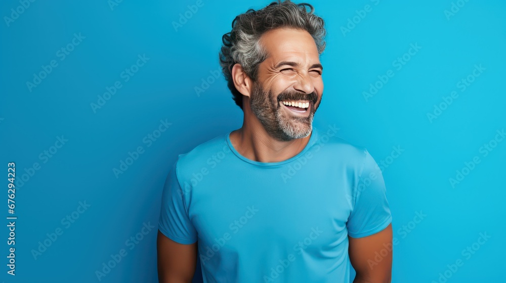 man in a smiling face in a blue background man in a smiling face in a blue background