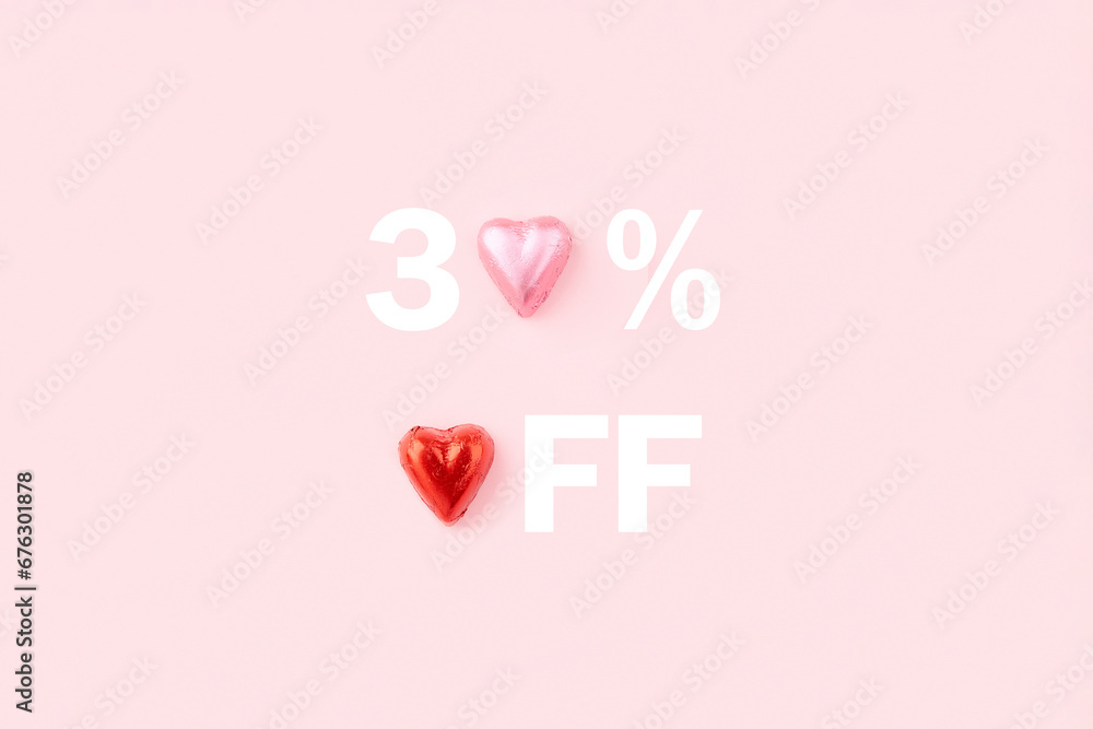 30 percent off sale banner. Heart shaped candies on pink background. 