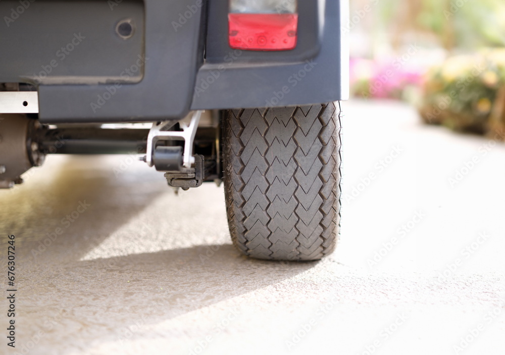Rubber black car wheel standing on asphalt closeup. Car parking rules concept Rubber black car wheel standing on asphalt closeup. Car parking rules concept